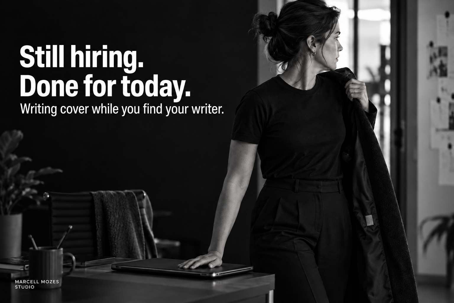 Still hiring. Done for today. A young marketing lead puts on her coat with a hand on her closed laptop.